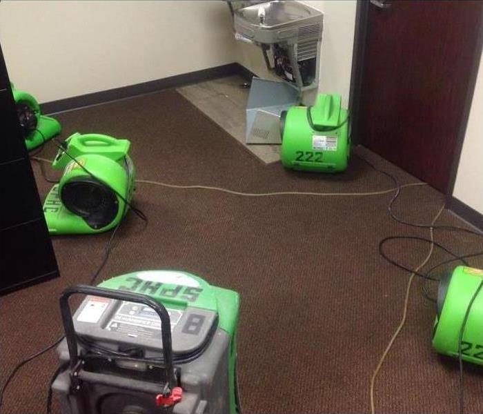water on carpet with servpro dryers